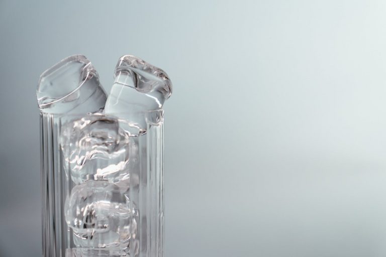 clear glass bottle with water